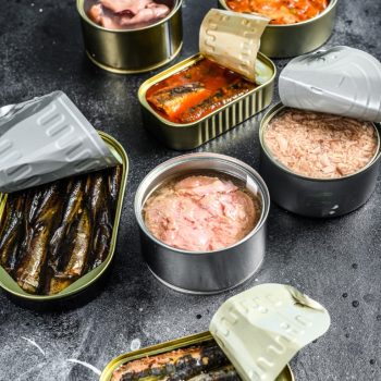 Assortment of cans, canned with different types of fish and seaf