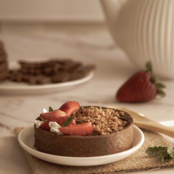 Closeup shot of a tart with chocolate and strawberries